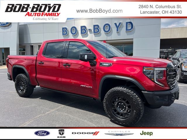2026 GMC Sierra 1500 AT4X in Volcanic Red — front three-quarter view